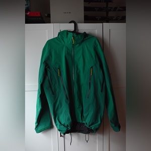 Arc’teryx green snowboarding jacket.